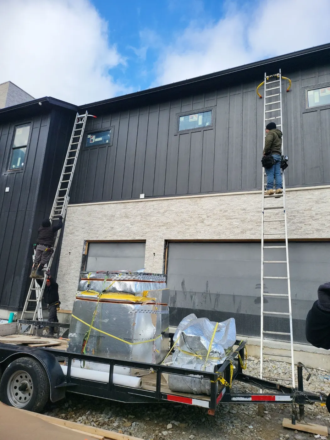 Siding installation documented in Merrimac