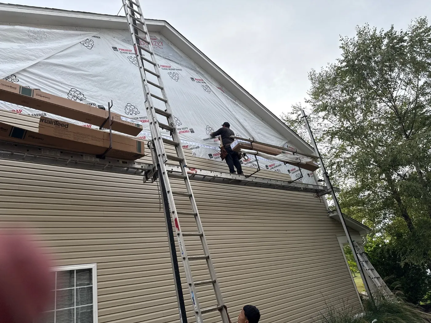 Storm-damaged siding documented in Merrimac